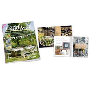 Zeitschrift „Landlust“ neben aufgeschlagenen Seiten mit Rezepten, Natur- und Gartenthemen sowie kreativen Ideen. Die Ausgabe wirbt für gemeinsames Feiern im Freien.